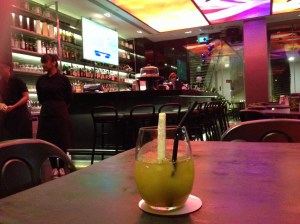 Enjoying Freshly Pressed Sugar Cane Juice at a Bar in Singapore